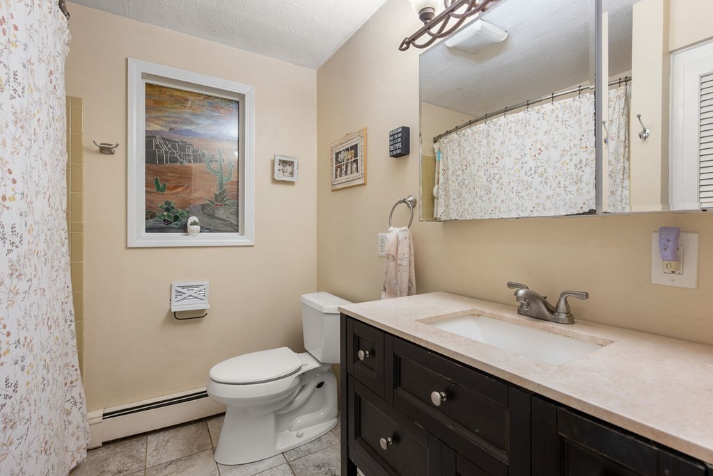 73 Northridge Road Westfield, MA 01085 - Photo 12 of 21 a bathroom with a toilet a sink and mirror