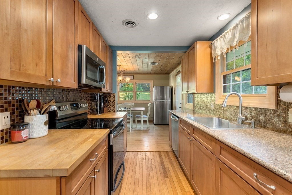 73 Northridge Road Westfield, MA 01085 - Photo 5 of 21 a kitchen with a sink a counter top space and stainless steel appliances