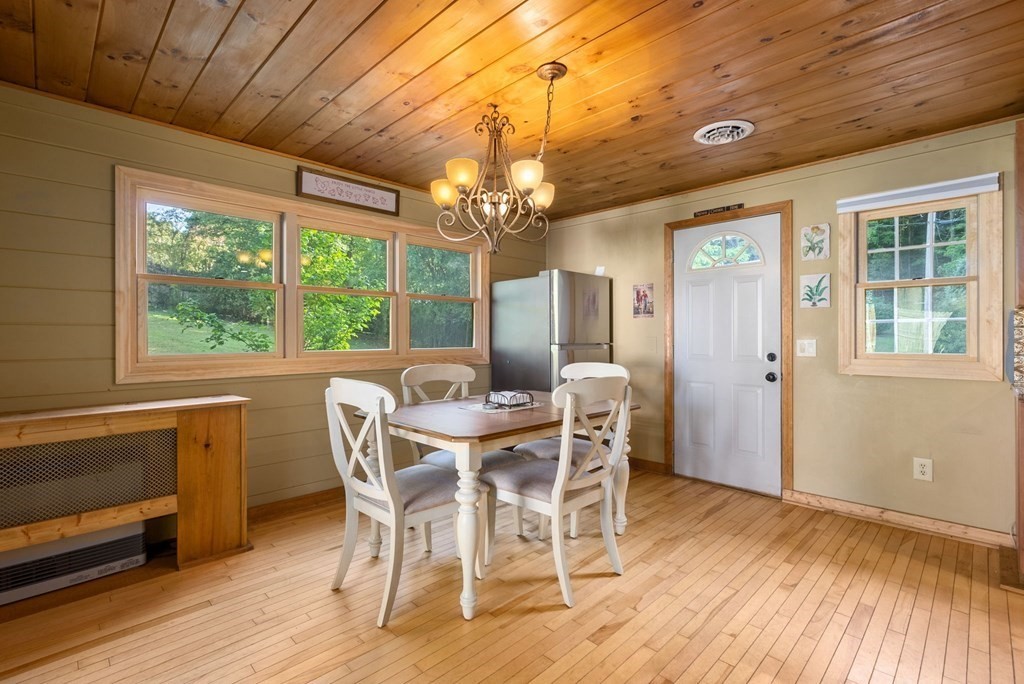 73 Northridge Road Westfield, MA 01085 - Photo 8 of 21 a view of a dining room with furniture a chandelier and wooden floor