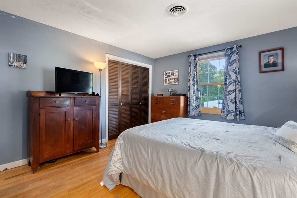 73 Northridge Road Westfield, MA 01085 - Photo 10 of 21 a bedroom with a bed and wooden floor