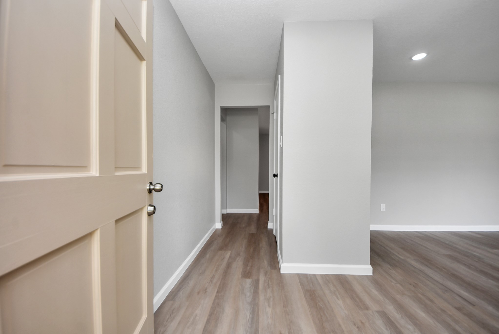 2402 Rolling Glen Drive Spring, TX 77373 - Photo 21 of 38 a view of a hallway with wooden floor and staircase