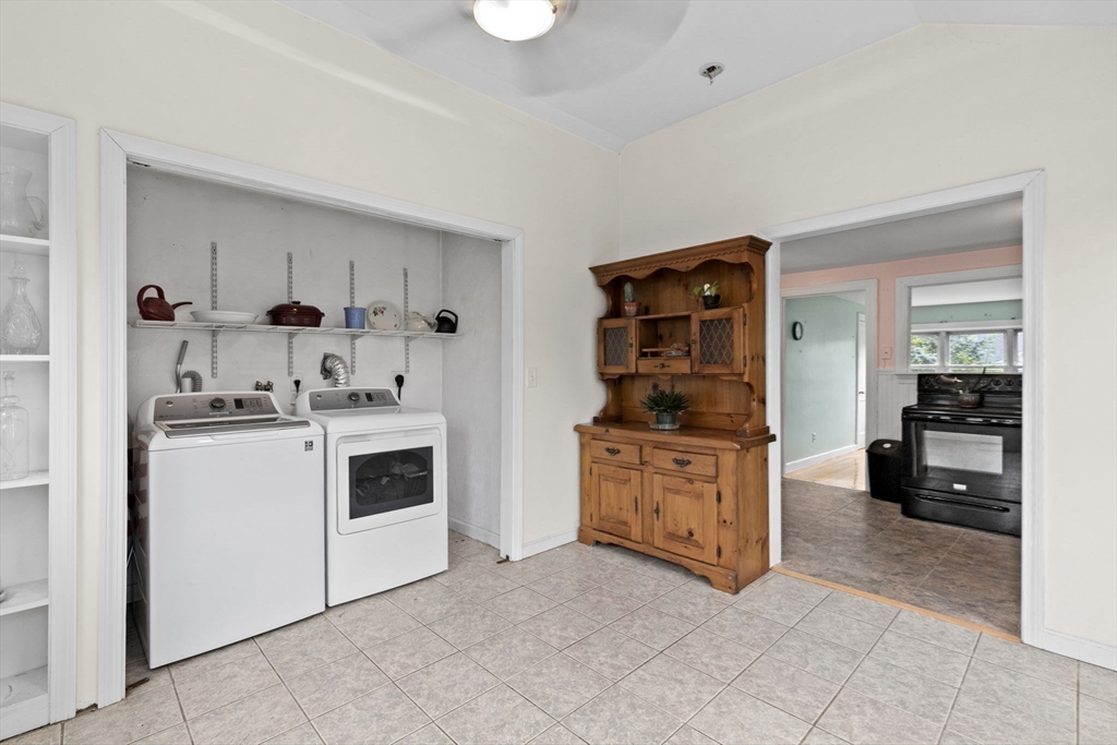 77 Olson Street Abington, MA 02351 - Photo 13 of 27 a kitchen with granite countertop white cabinets and white appliances