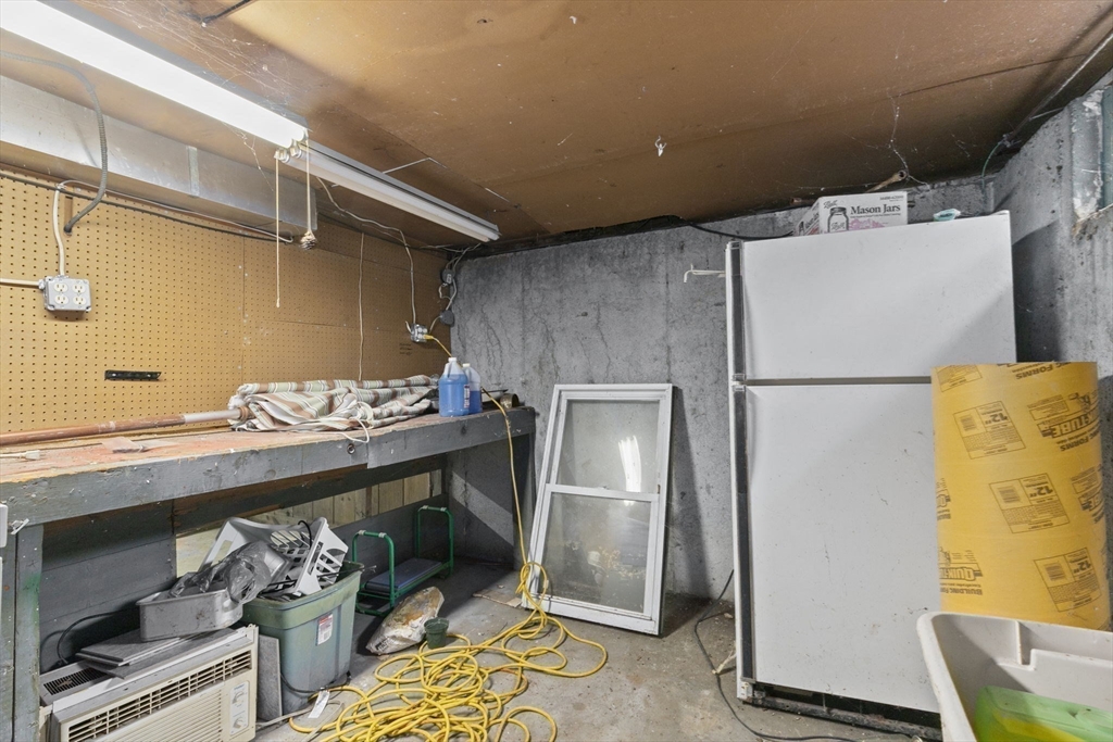77 Olson Street Abington, MA 02351 - Photo 21 of 27 a kitchen with stainless steel appliances a refrigerator and a stove