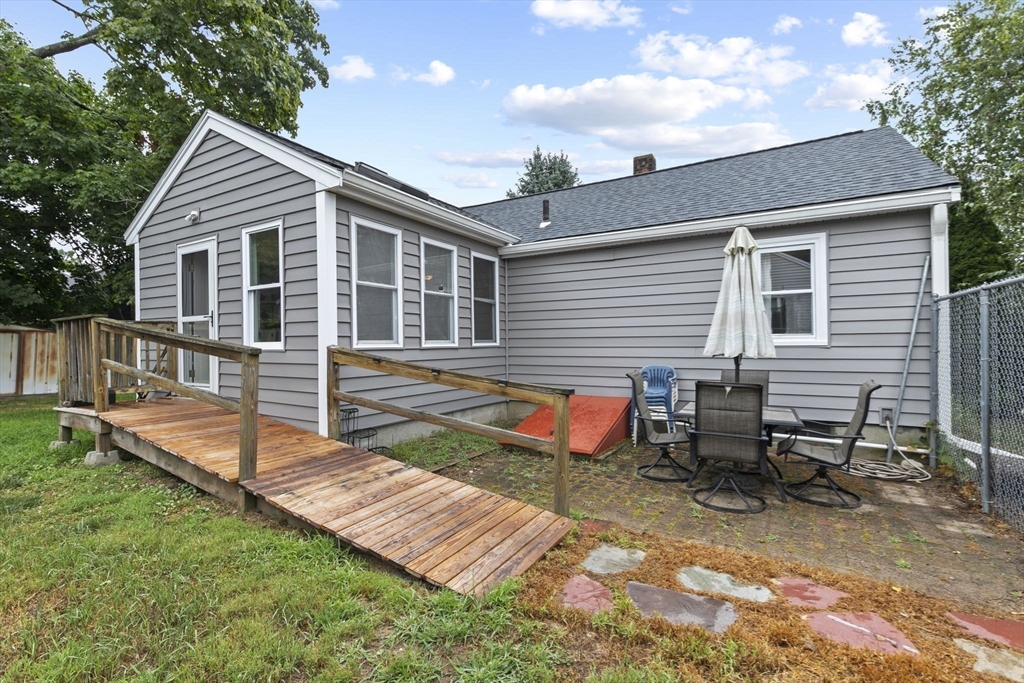 77 Olson Street Abington, MA 02351 - Photo 24 of 27 a view of a house with backyard and sitting area