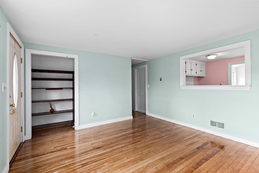 77 Olson Street Abington, MA 02351 - Photo 3 of 27 a view of an empty room with wooden floor