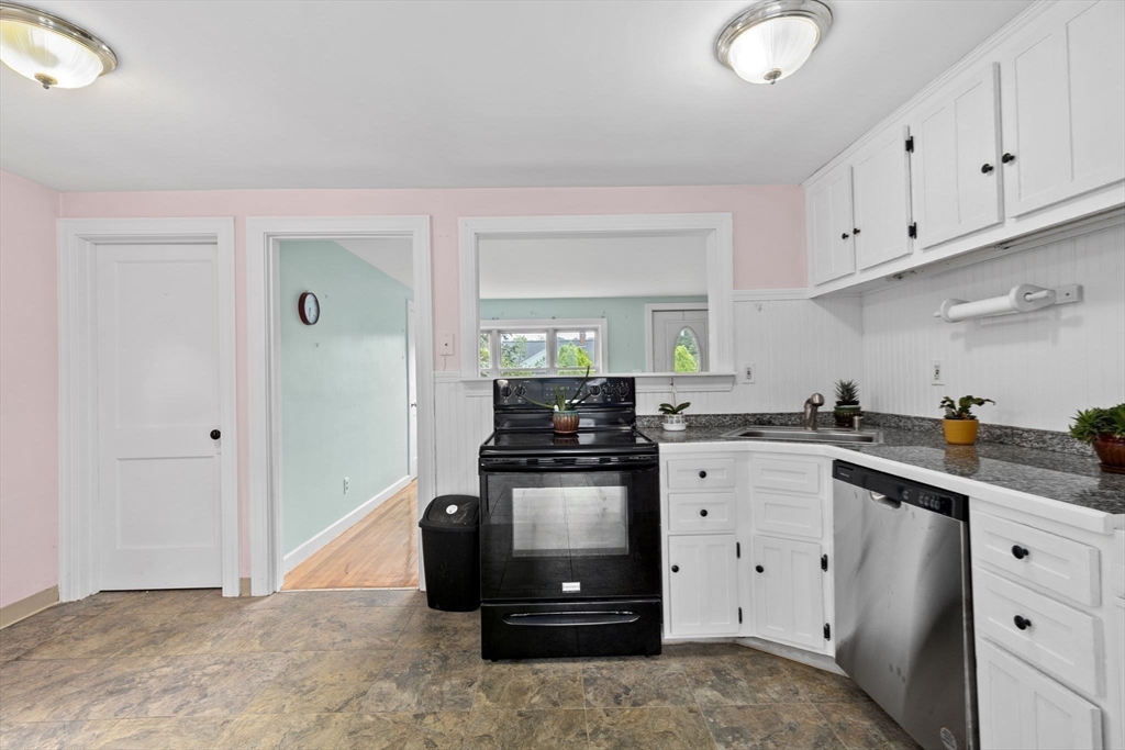 77 Olson Street Abington, MA 02351 - Photo 7 of 27 a kitchen with cabinets and appliances