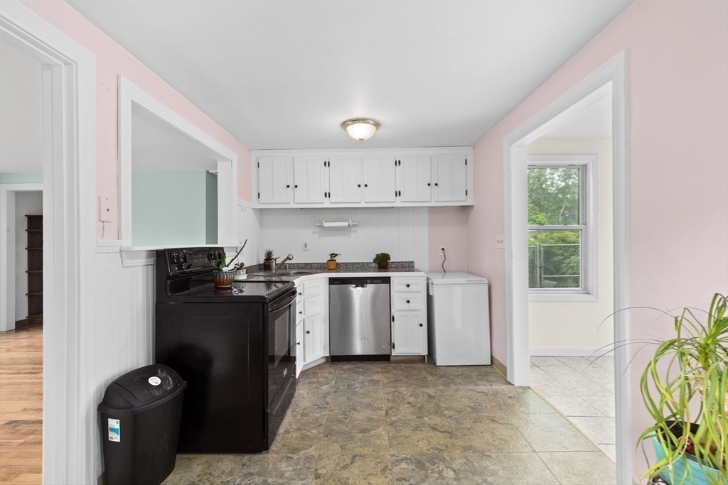 77 Olson Street Abington, MA 02351 - Photo 8 of 27 a kitchen with a stove a sink and a window