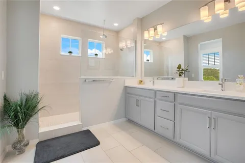 a bathroom with a sink toilet and window