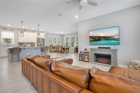 a kitchen with stainless steel appliances white cabinets and a stove top oven