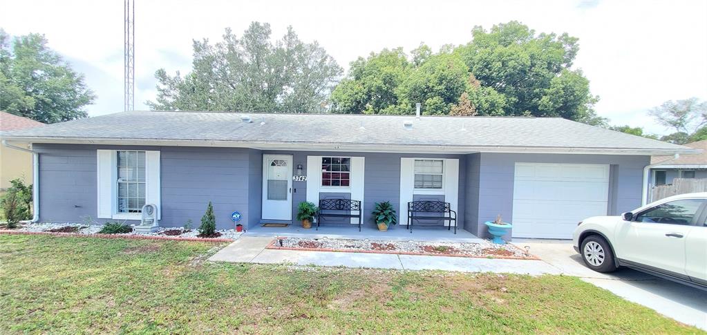 3742 Southwest 150th Loop Ocala, FL 34473 - Photo 1 of 1 a view of a house with a porch and furniture