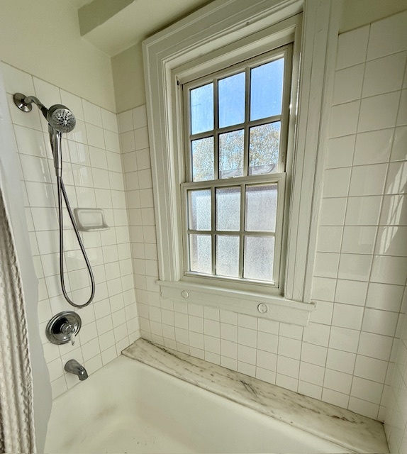 307 North Prairie Street, Unit 9 Champaign, IL 61820 - Photo 18 of 41 a bathroom with a bathtub and shower