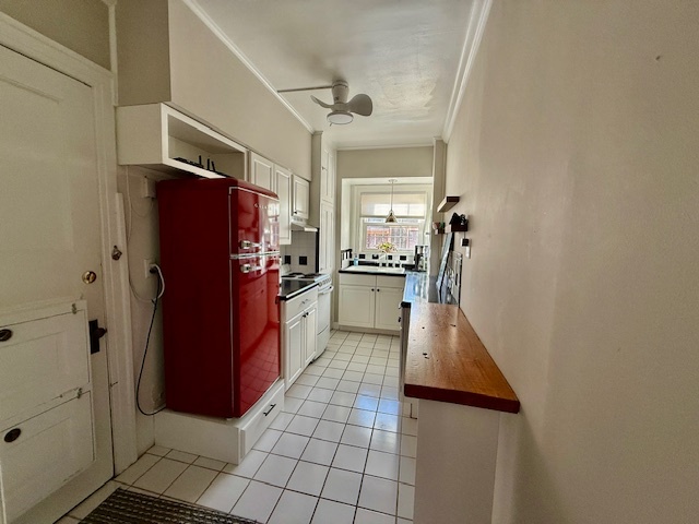 307 North Prairie Street, Unit 9 Champaign, IL 61820 - Photo 7 of 41 a kitchen with stainless steel appliances granite countertop a refrigerator and a stove