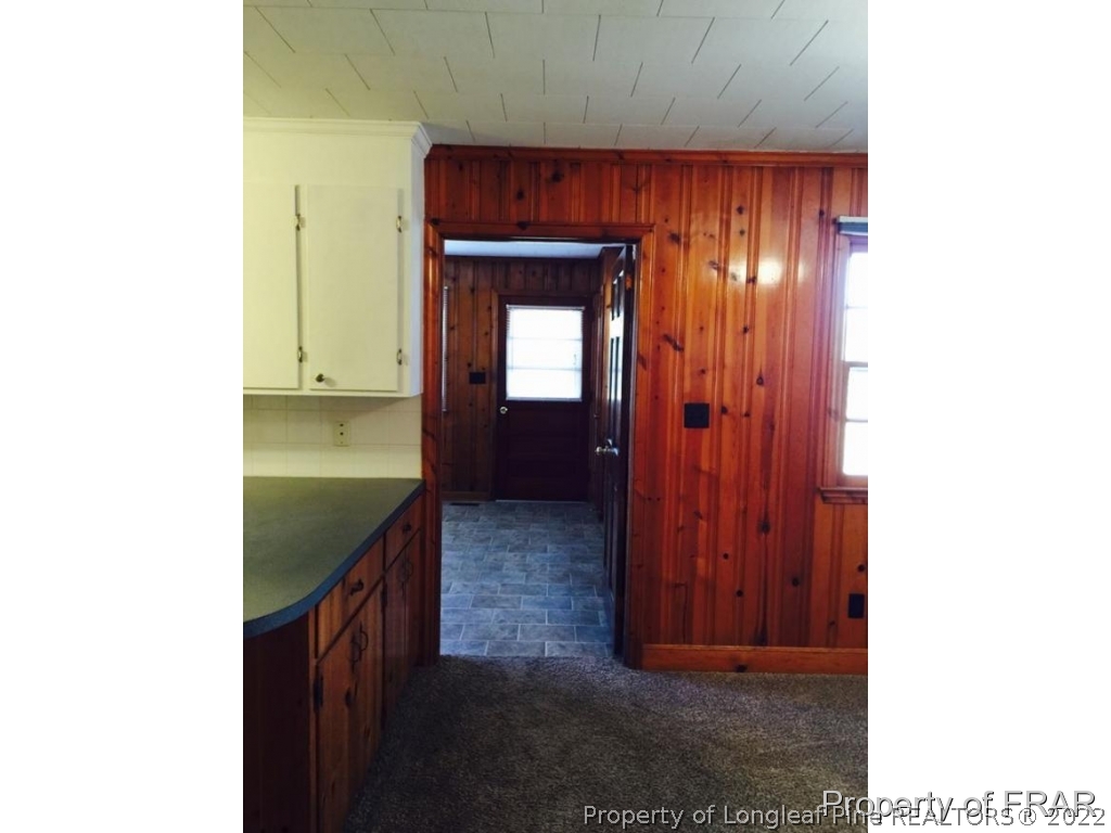 298 Magnolia Church Road Stedman, NC 28391 - Photo 24 of 33 a view of a hallway with wooden floor