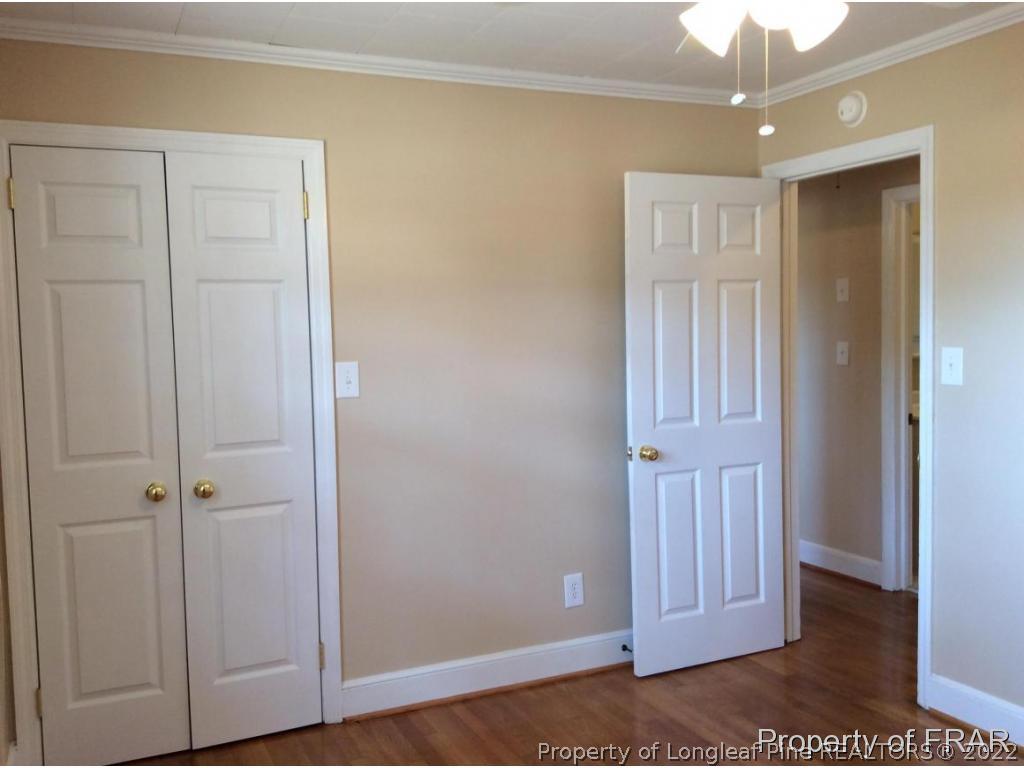 298 Magnolia Church Road Stedman, NC 28391 - Photo 6 of 33 a view of a hallway with wooden floor