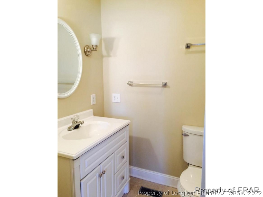 298 Magnolia Church Road Stedman, NC 28391 - Photo 8 of 33 a bathroom with a sink a toilet and mirror