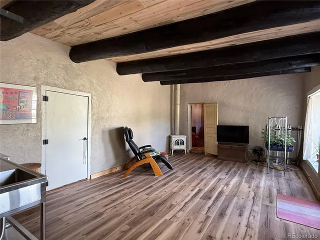 a view of a livingroom with furniture and a fireplace