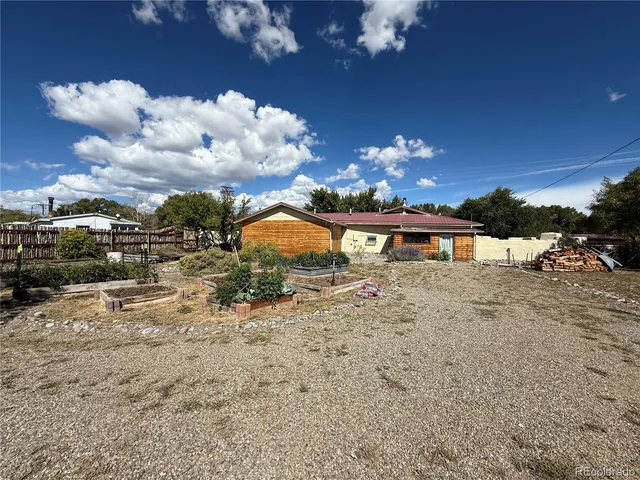 a view of a yard with a tree