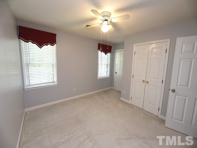 312 Baytree Lane Raleigh, NC 27615 - Photo 10 of 12 a view of an empty room with a window