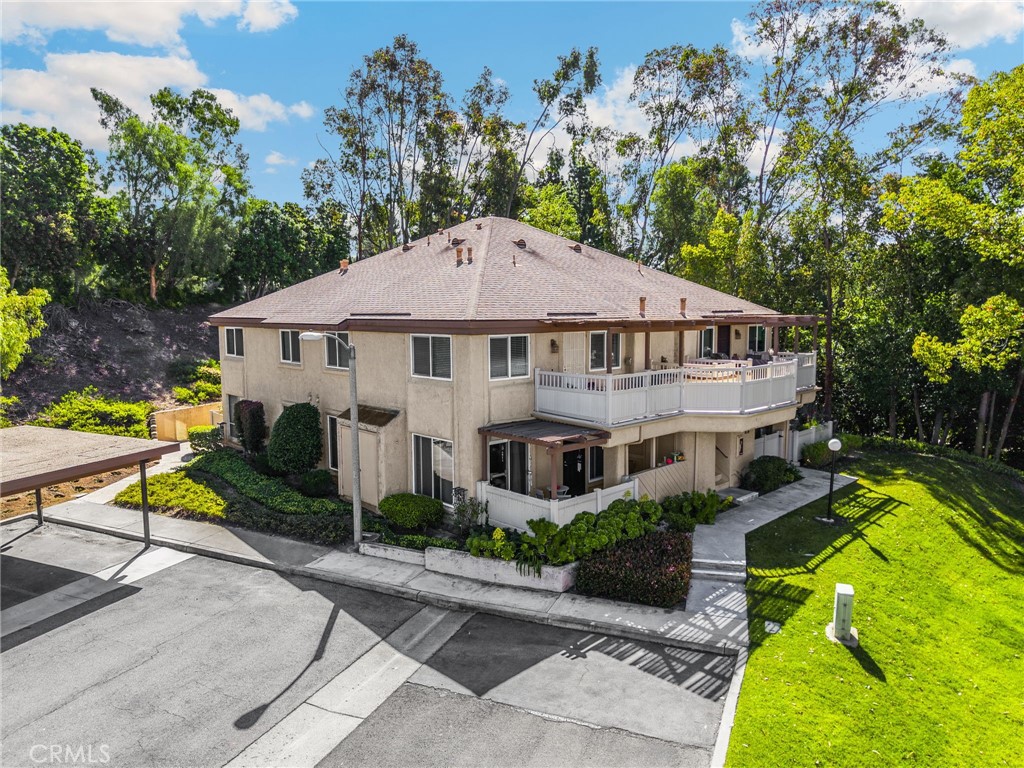 a aerial view of a house with swimming pool garden and patio