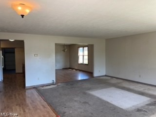 18601 Libby Road Maple Heights, OH 44137 - Photo 5 of 20 Spare room with hardwood flooring