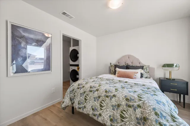 a bedroom with a bed and glass windows