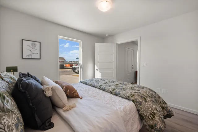 a bedroom with a bed and a couch