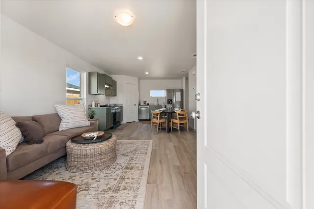 a living room with furniture and a table