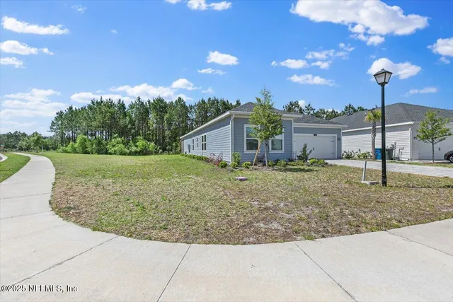 a view of a house with a yard