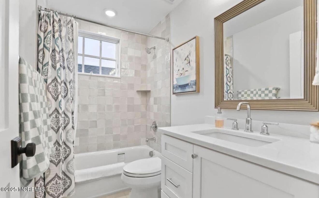 7 Center Street Sea Bright, NJ 07760 - Photo 11 of 19 a bathroom with a sink a toilet and a bathtub