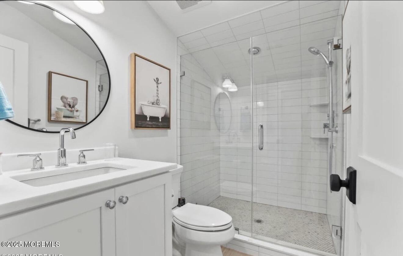 7 Center Street Sea Bright, NJ 07760 - Photo 13 of 19 a bathroom with a sink a toilet and shower