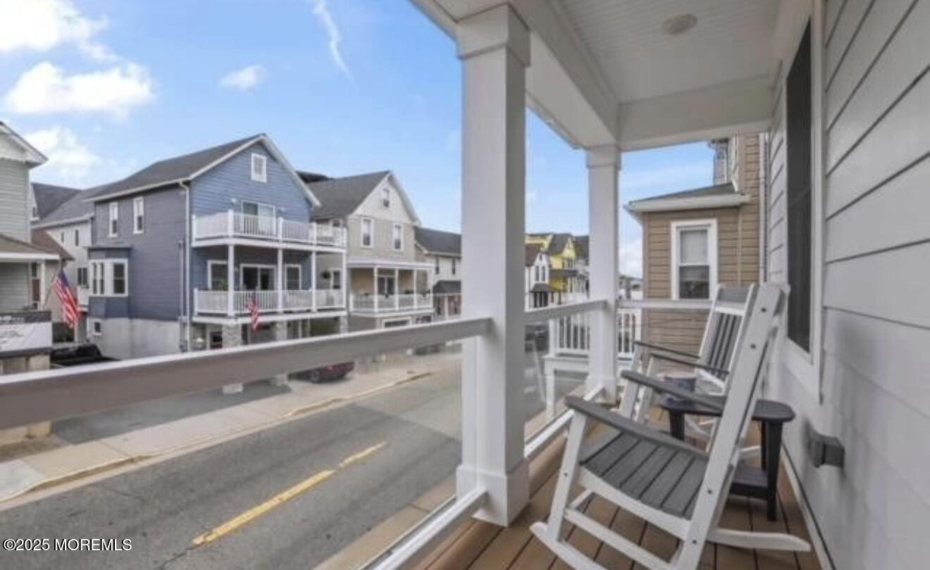 7 Center Street Sea Bright, NJ 07760 - Photo 3 of 19 a view of a balcony with chairs