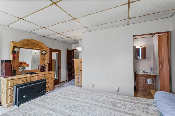 a large kitchen with stainless steel appliances granite countertop a refrigerator and a stove top oven