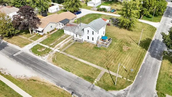 an aerial view of residential houses with outdoor space