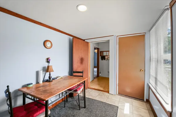 a dining room with a table and chairs