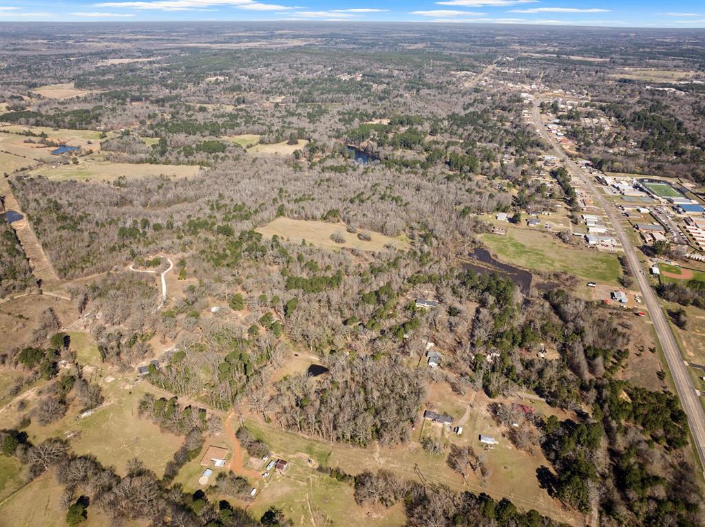 Tbd Nix Street Daingerfield, TX 75638 - Photo 12 of 16 an aerial view of residential houses with outdoor space
