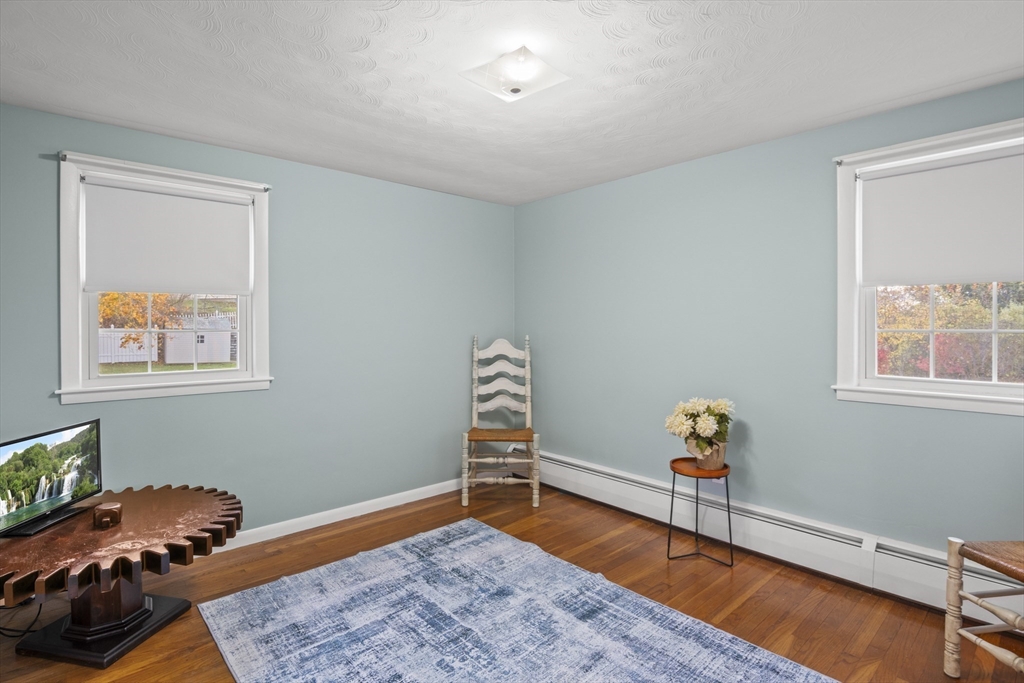 78 2nd Island Road Webster, MA 01570 - Photo 17 of 28 a bedroom with a bed and wooden floor