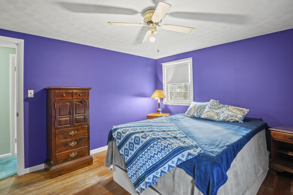 78 2nd Island Road Webster, MA 01570 - Photo 22 of 28 a bedroom with a bed and a dresser