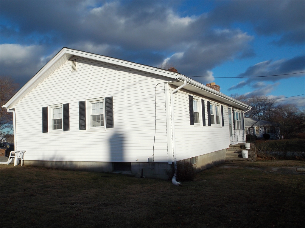 78 2nd Island Road Webster, MA 01570 - Photo 23 of 28 a front view of a house with a yard
