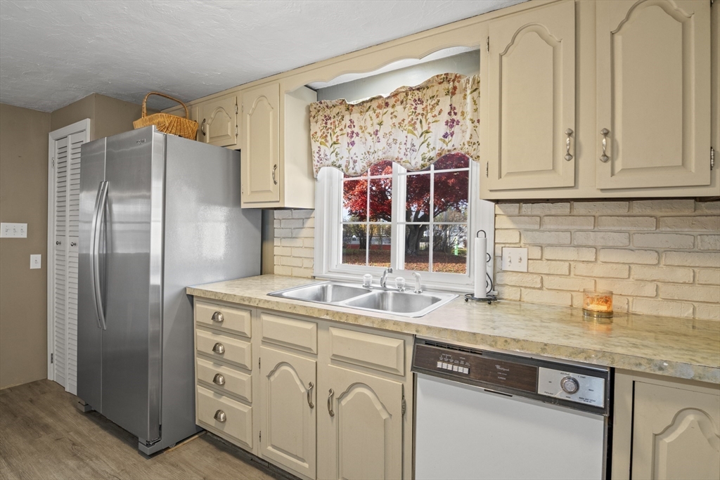 78 2nd Island Road Webster, MA 01570 - Photo 3 of 28 a kitchen with stainless steel appliances granite countertop a sink and a refrigerator
