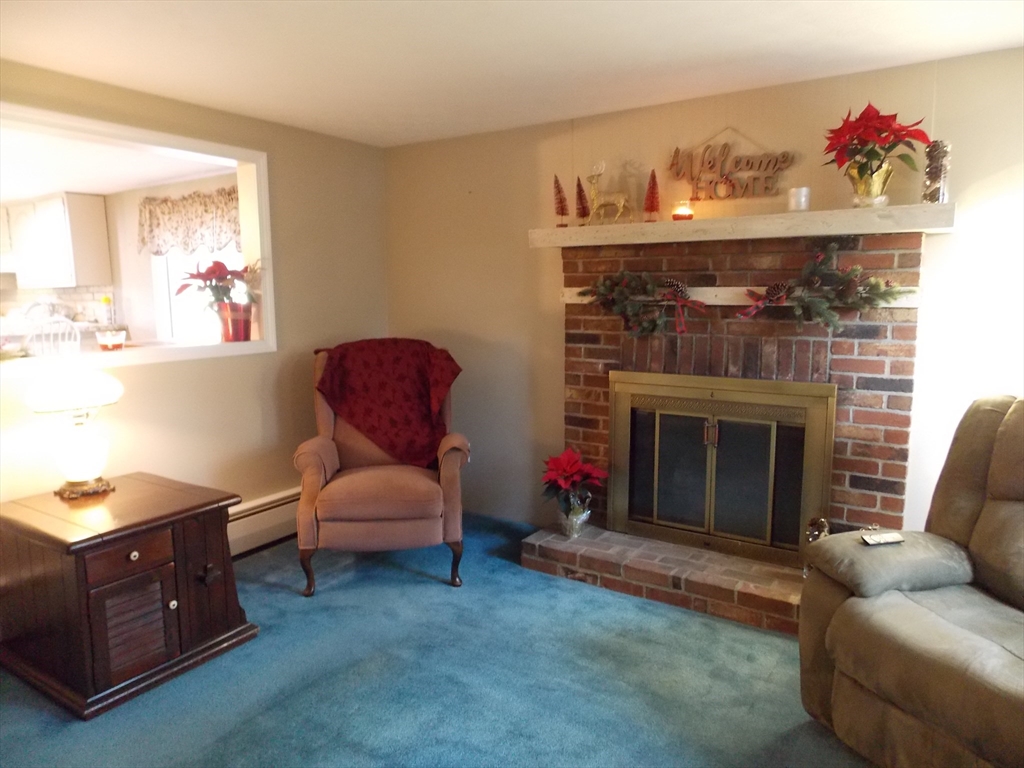 78 2nd Island Road Webster, MA 01570 - Photo 4 of 29 a living room with furniture and a fireplace