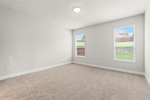 2808 Inn Kitchen Way McKinney, TX 75071 - Photo 12 of 22 Neutral-toned walls and plush carpet create a versatile interior