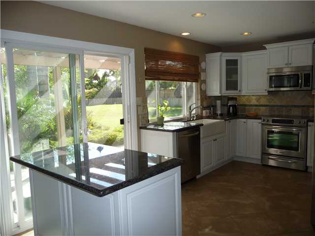 4603 Sheridan Road Oceanside, CA 92056 - Photo 8 of 25 Remodeled kitchen with tile floors and newer stainless steel