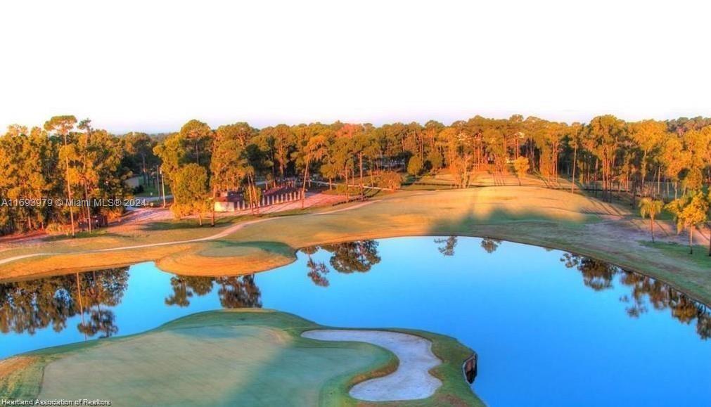 6503 Colma Avenue Sebring, FL 33872 - Photo 4 of 28 a view of a swimming pool with an outdoor seating