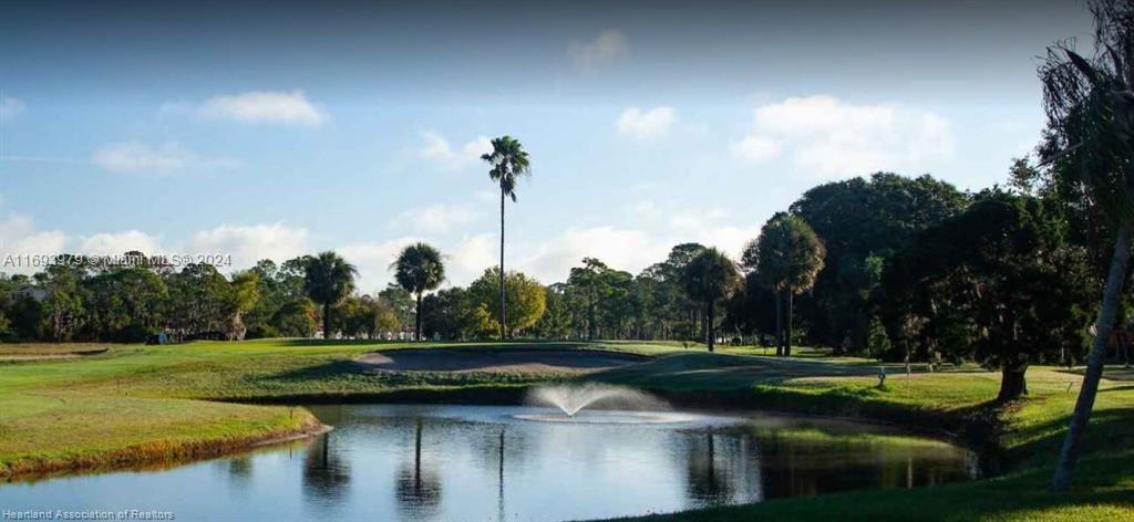 6503 Colma Avenue Sebring, FL 33872 - Photo 9 of 28 a view of a golf course with a lake