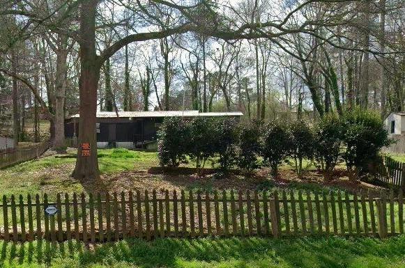 90 Valley Trail Southeast Acworth, GA 30101 - Photo 1 of 28 a front view of a house with a garden