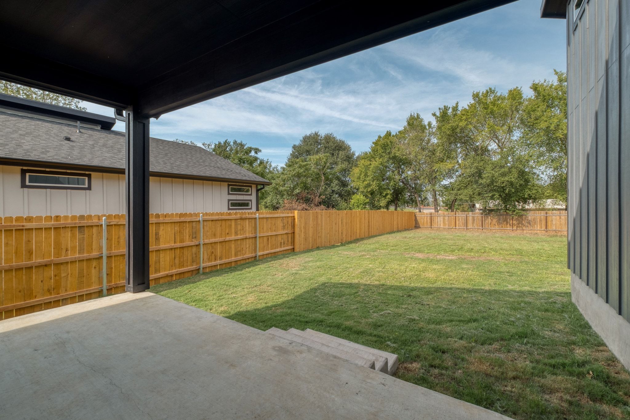 202 Washington Street Elgin, TX 78621 - Photo 24 of 26 Fenced backyard featuring a patio