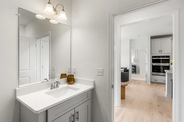 a bathroom with a sink a vanity and a mirror