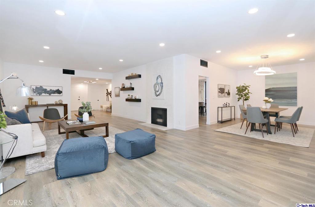 1210 North Kings Road, Unit 101 West Hollywood, CA 90069 - Photo 1 of 1 a living room with furniture and a wooden floor