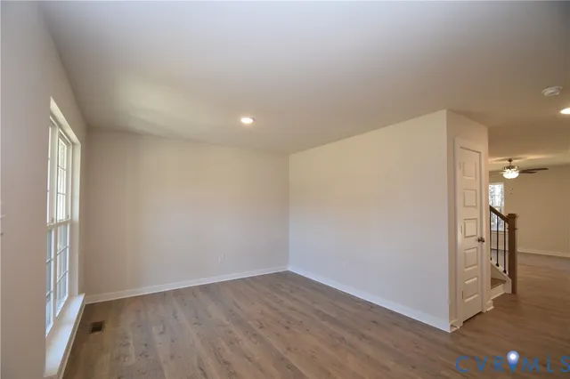 a view of hallway with wooden floor