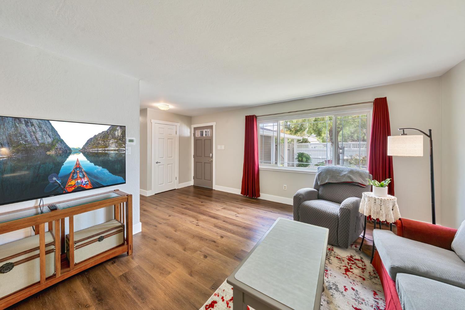 5422 Earnell Street Carmichael, CA 95608 - Photo 9 of 39 a living room with furniture and a floor to ceiling window